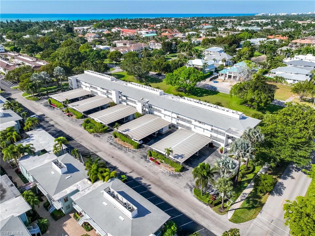610 Broad Avenue South, Unit J610 Naples, FL 34102 - Photo 19 of 20 Drone / aerial view of a large body of water