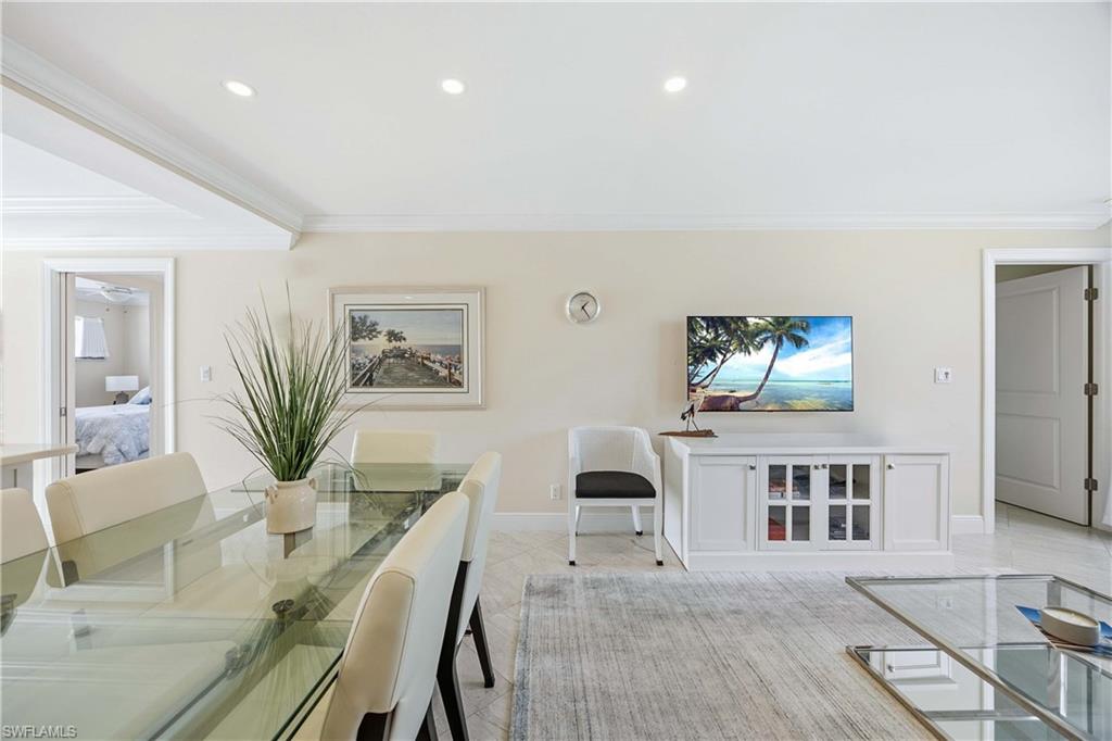 610 Broad Avenue South, Unit J610 Naples, FL 34102 - Photo 6 of 20 Dining space featuring crown molding and recessed lighting