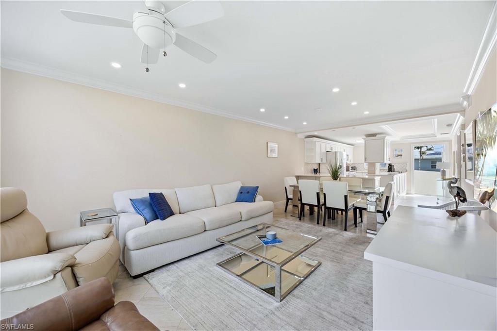 610 Broad Avenue South, Unit J610 Naples, FL 34102 - Photo 7 of 20 Living area with crown molding, recessed lighting, and a ceiling fan