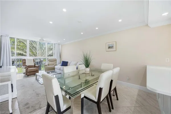 a view of a dining room with furniture window and outside view