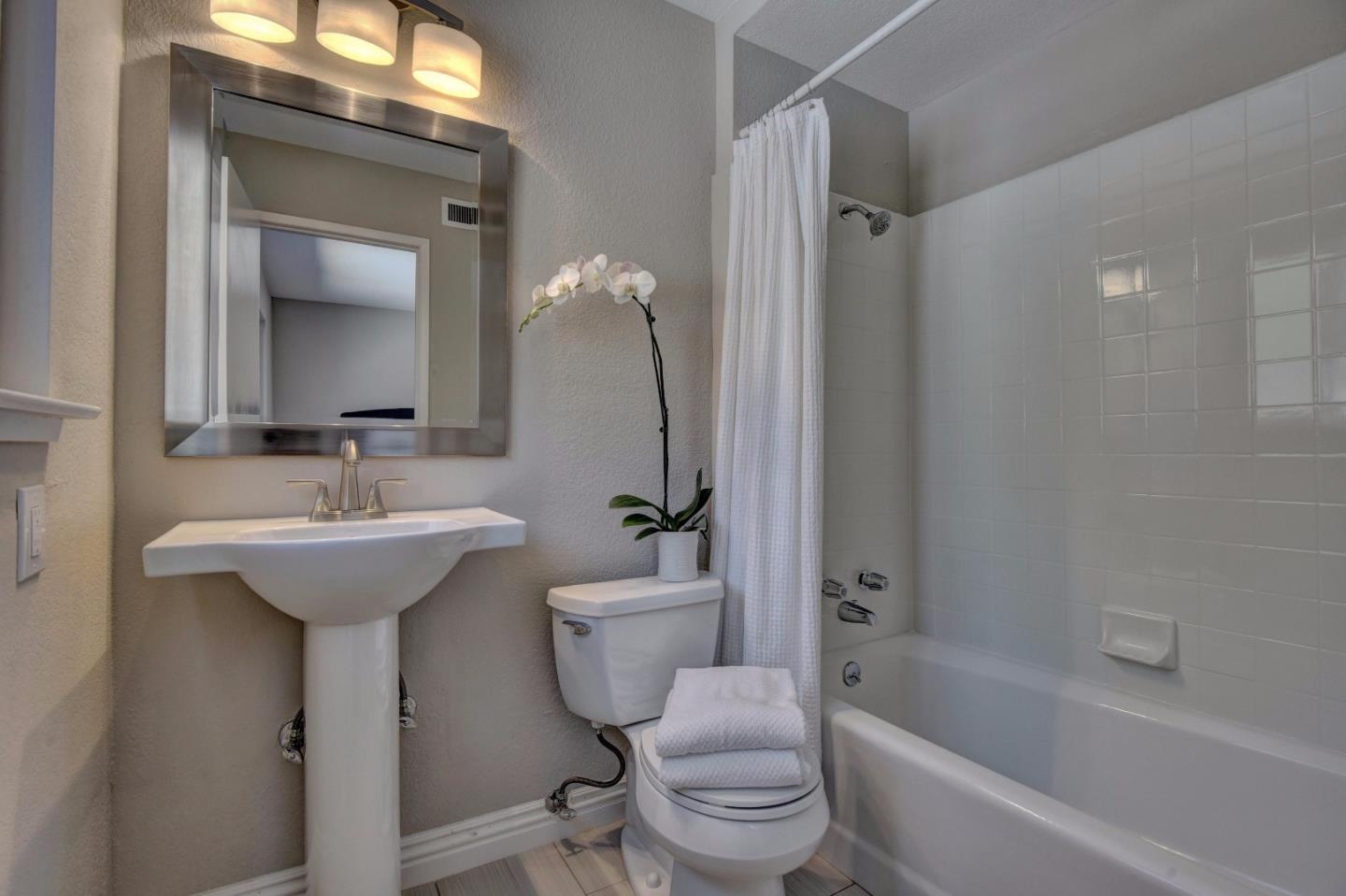 4528 Piper Drive San Jose, CA 95129 - Photo 11 of 15 a bathroom with a sink toilet tub and shower