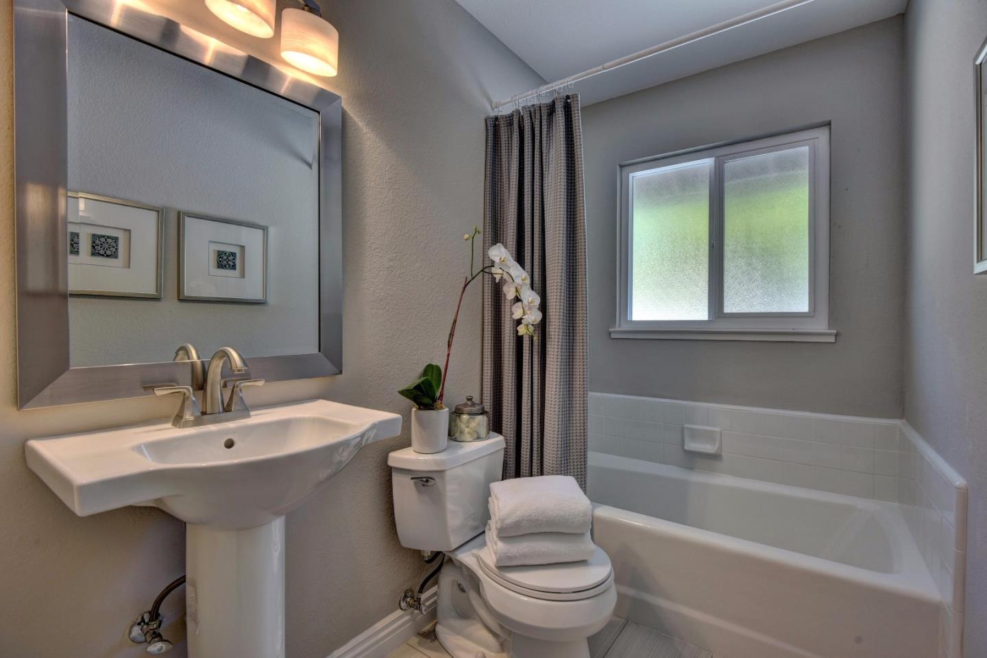 4528 Piper Drive San Jose, CA 95129 - Photo 14 of 15 a bathroom with a sink toilet and shower