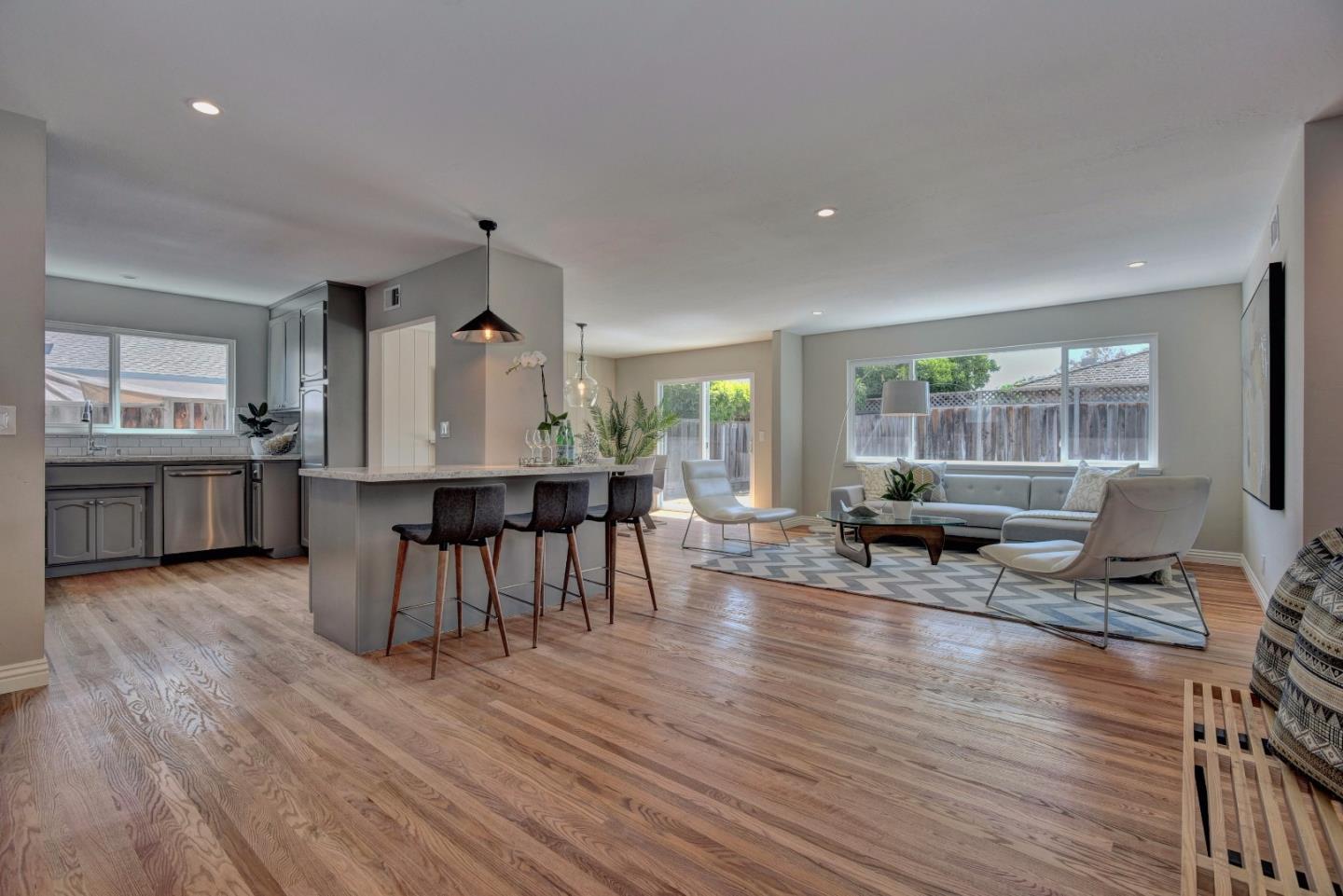 4528 Piper Drive San Jose, CA 95129 - Photo 2 of 15 a living room with furniture a wooden floor and next to a window