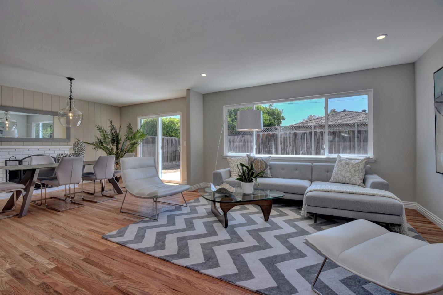 4528 Piper Drive San Jose, CA 95129 - Photo 4 of 15 a living room with furniture fireplace and a large window