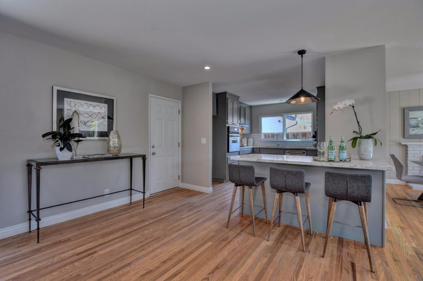 4528 Piper Drive San Jose, CA 95129 - Photo 6 of 15 a view of a dining room with furniture and wooden floor