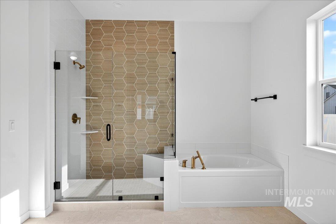 14675 Serenity Pt Street Caldwell, ID 83607 - Photo 13 of 14 Bathroom with a bath, a shower stall, tile patterned floors, and plenty of natural light