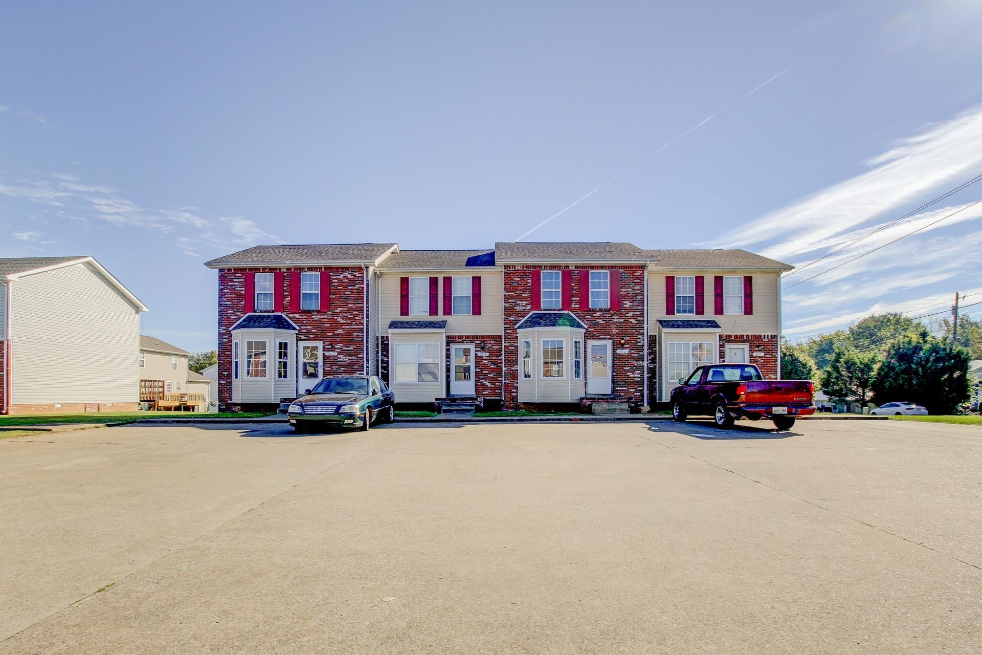 a view of a cars in front of a house