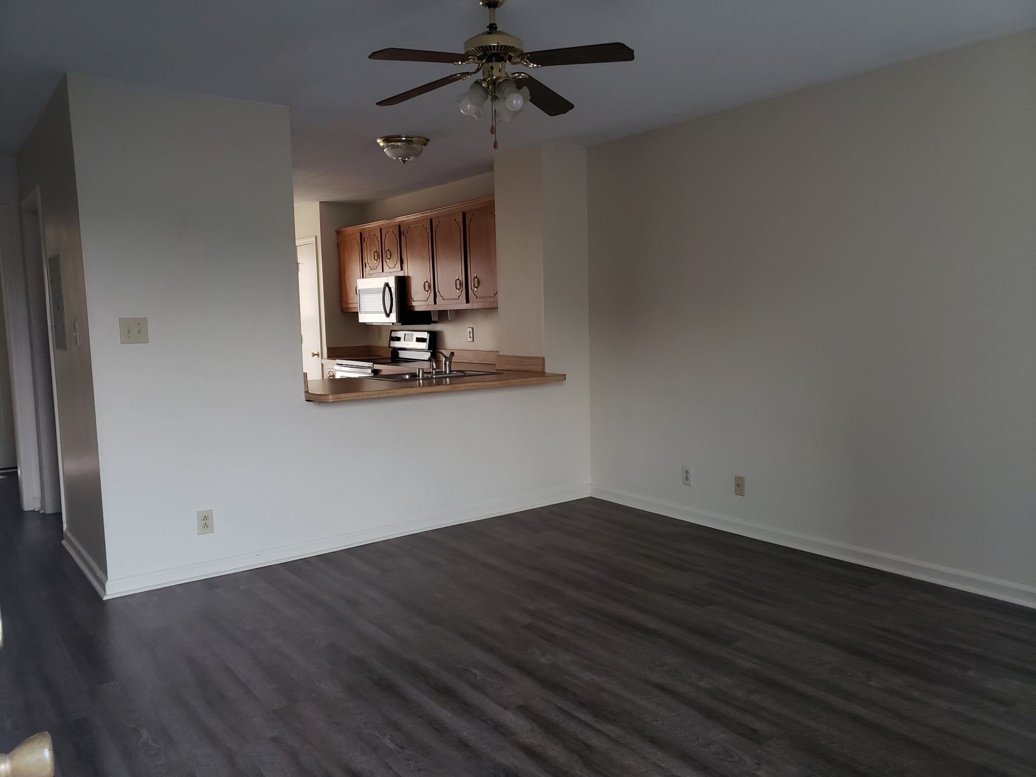 200 Tree Line Drive Oak Grove, KY 42262 - Photo 15 of 58 an empty room with wooden floor a ceiling fan and windows