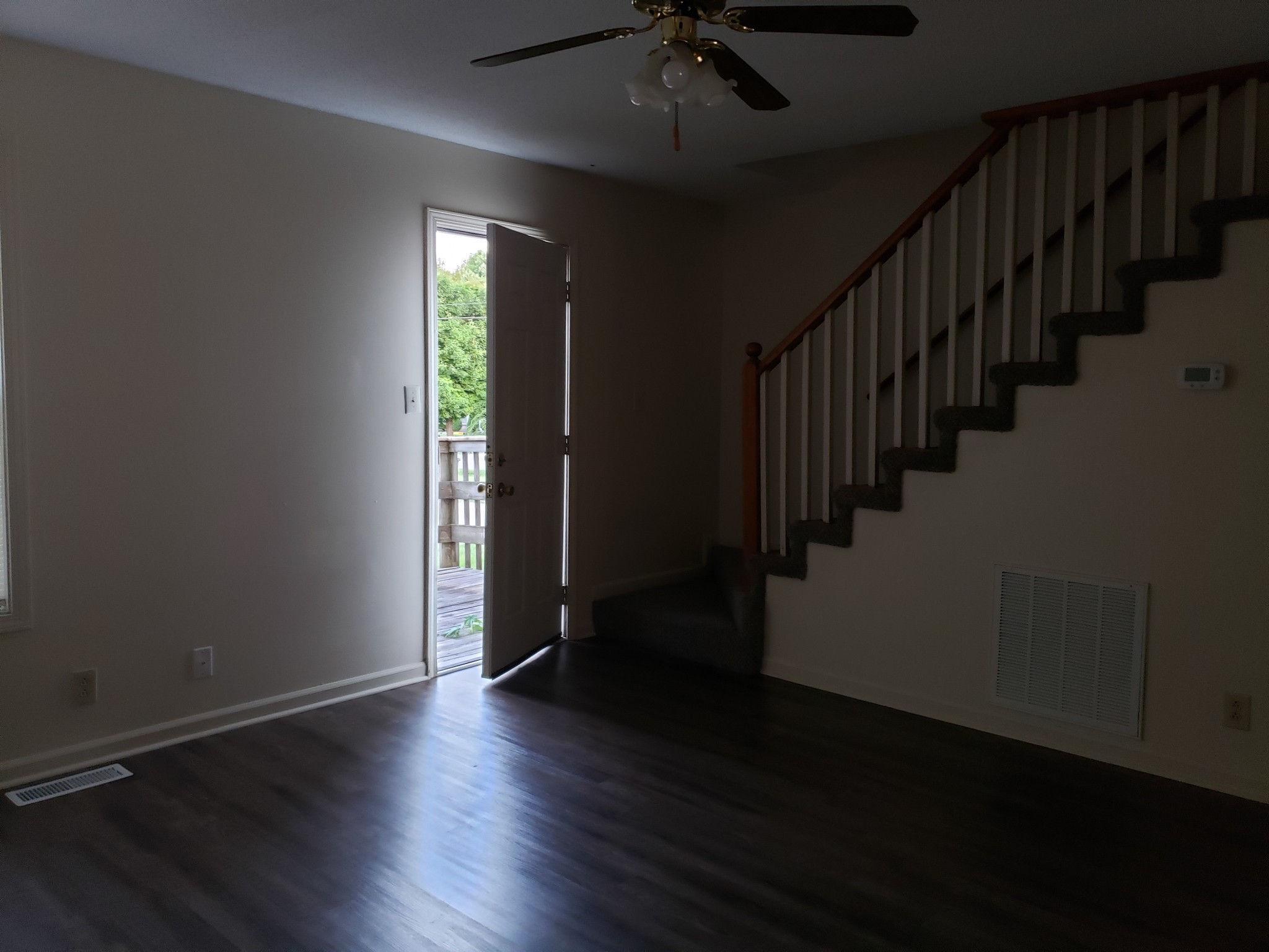 200 Tree Line Drive Oak Grove, KY 42262 - Photo 16 of 58 an empty room with wooden floor windows and stairs