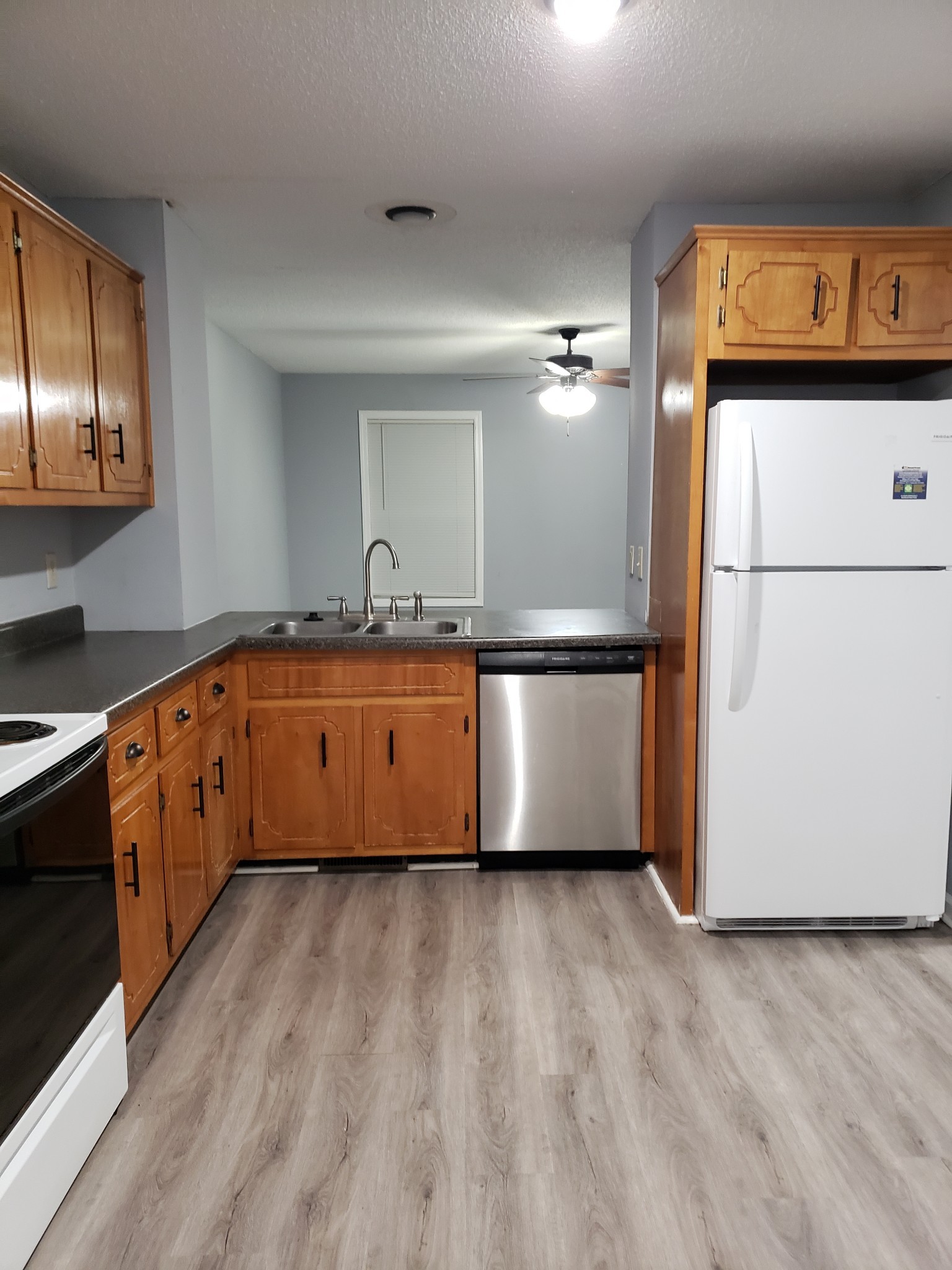 200 Tree Line Drive Oak Grove, KY 42262 - Photo 27 of 58 a kitchen with granite countertop a refrigerator a sink and dishwasher