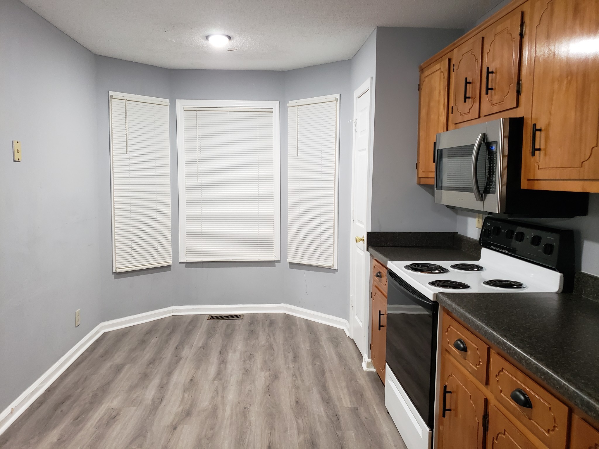 200 Tree Line Drive Oak Grove, KY 42262 - Photo 28 of 58 a kitchen with stainless steel appliances granite countertop a stove and a microwave
