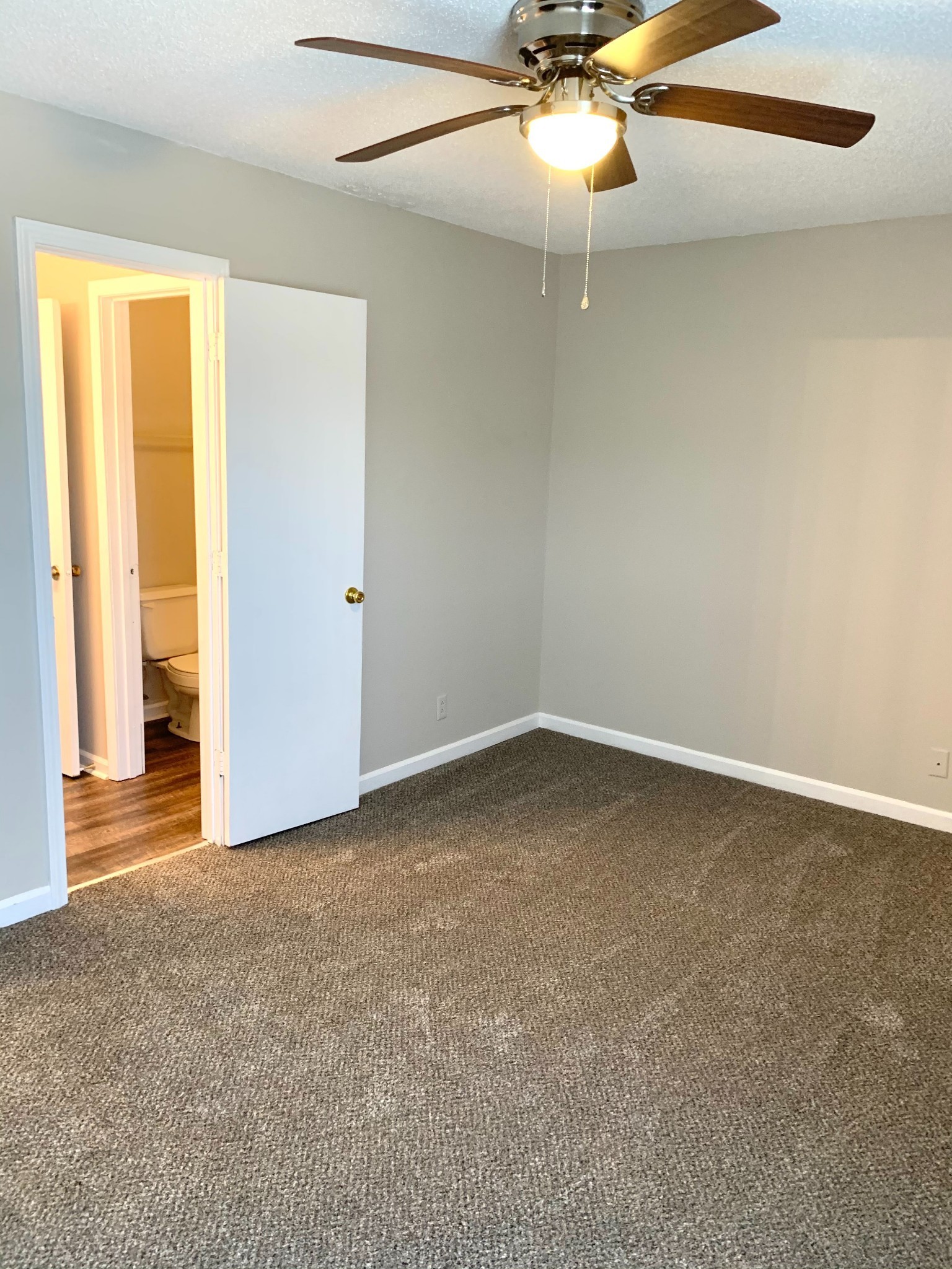 200 Tree Line Drive Oak Grove, KY 42262 - Photo 44 of 58 an empty room with a ceiling fan and carpet