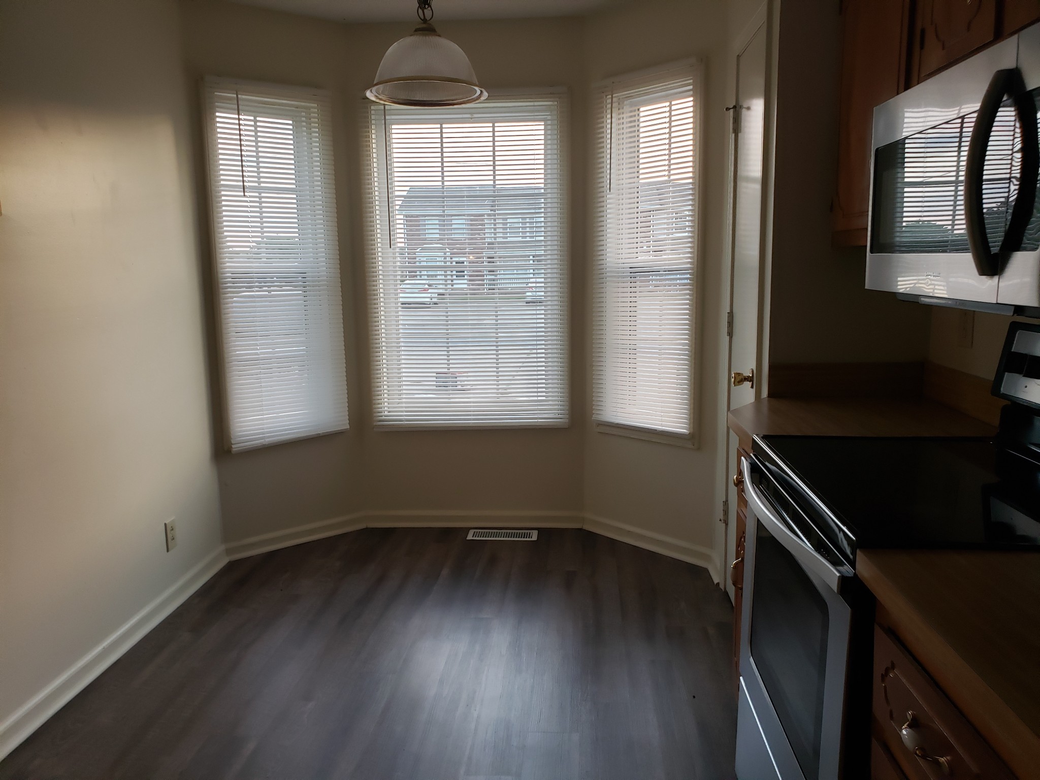 200 Tree Line Drive Oak Grove, KY 42262 - Photo 5 of 58 an empty room with wooden floor and windows