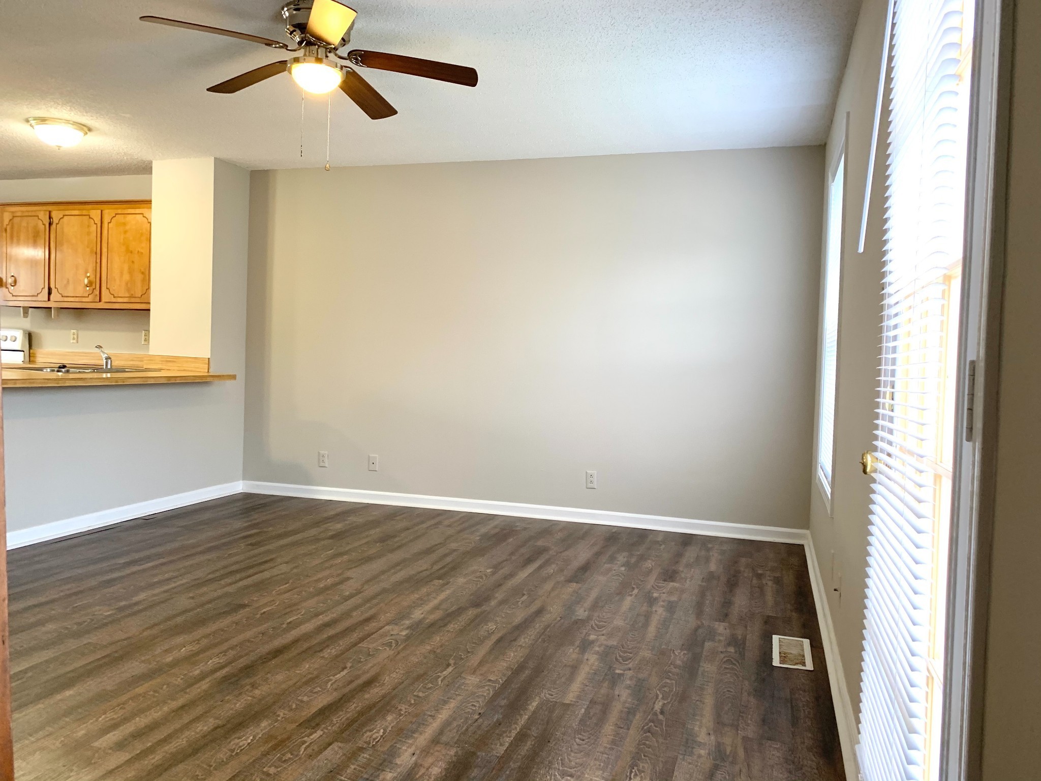 200 Tree Line Drive Oak Grove, KY 42262 - Photo 55 of 58 an empty room with wooden floor fan and windows