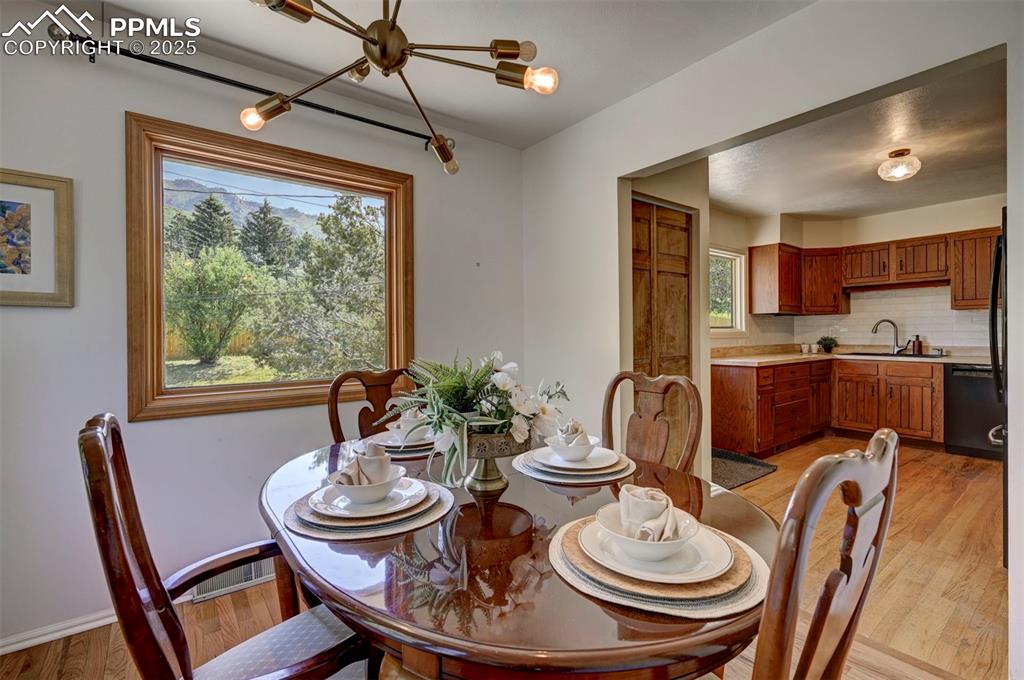 4665 Fox Road Cascade, CO 80809 - Photo 16 of 50 a kitchen with a dining table and chairs