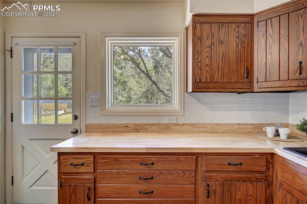 4665 Fox Road Cascade, CO 80809 - Photo 21 of 50 a view of a kitchen with granite countertop cabinets