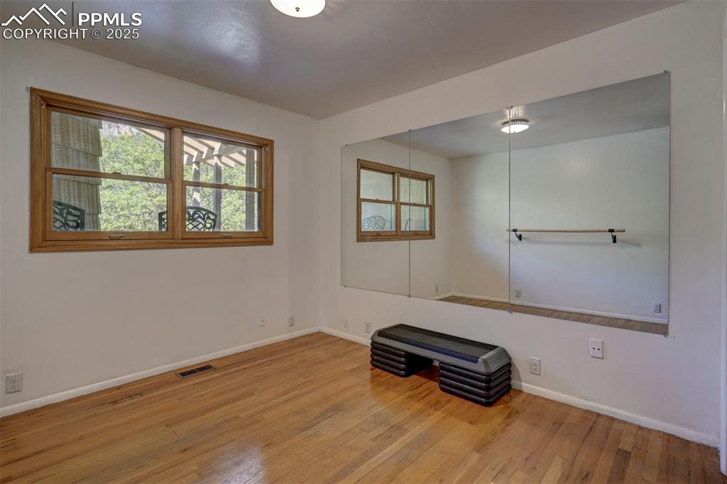 4665 Fox Road Cascade, CO 80809 - Photo 35 of 50 a room with a window and wooden floor