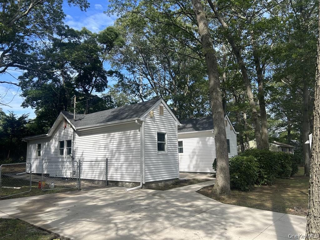 277 Prince Road Rocky Point, NY 11778 - Photo 2 of 19 View of property exterior with a shingled roof