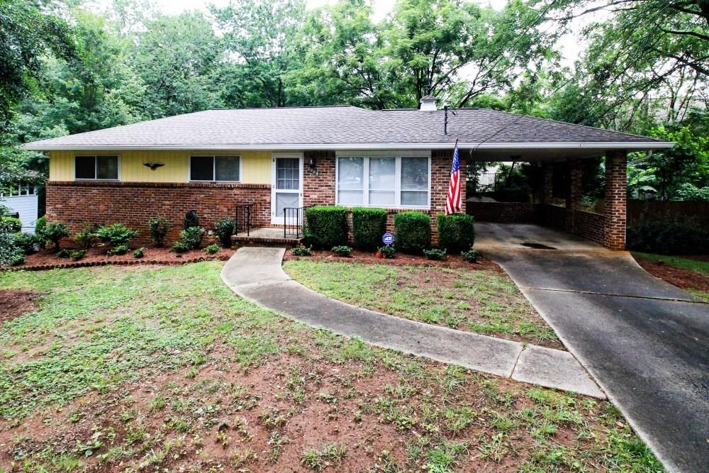 2964 Harcourt Drive Decatur, GA 30033 - Photo 1 of 1 a view of a white house with a yard plants and large tree