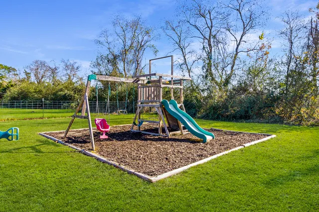 a view of a park with swings