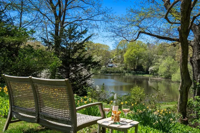 a view of a wooden deck with a lake view