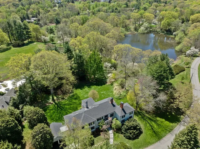 an aerial view of residential house with outdoor space and lake view