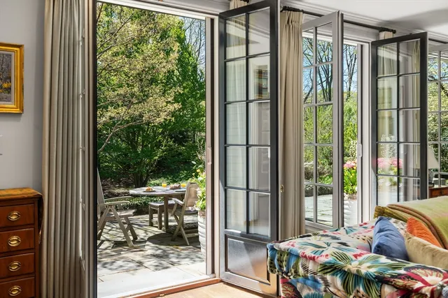 a bed room with a bed and a balcony