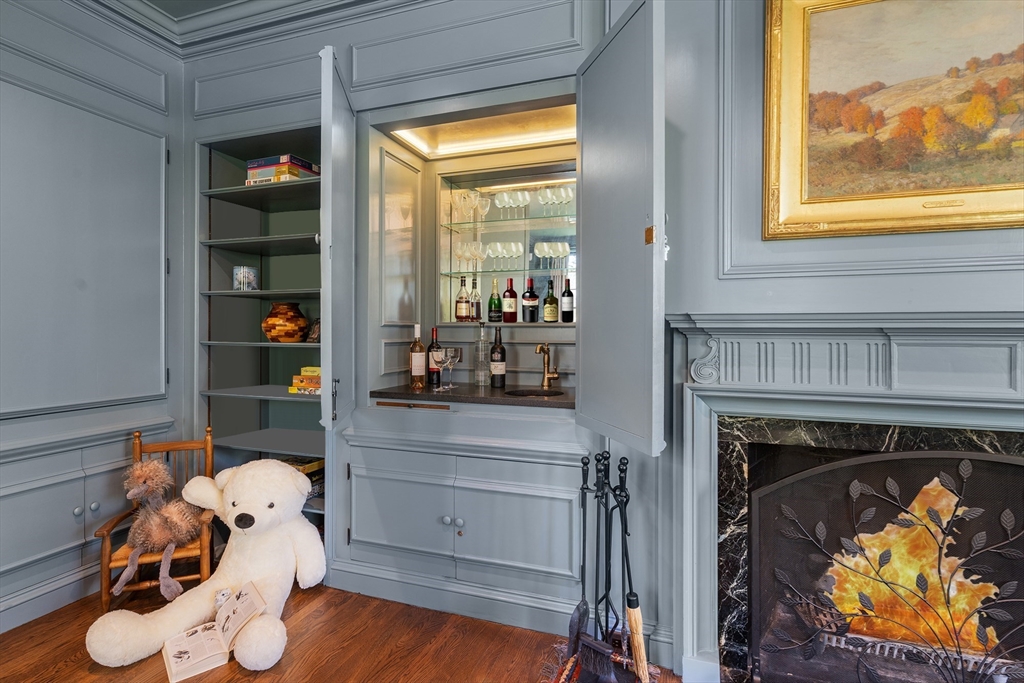 21 Sargent Crossway Brookline, MA 02445 - Photo 27 of 36 a room with furniture and a fireplace