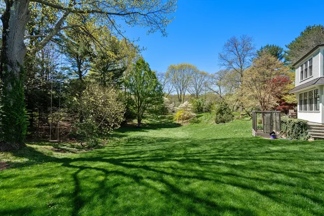 a view of a park with a house