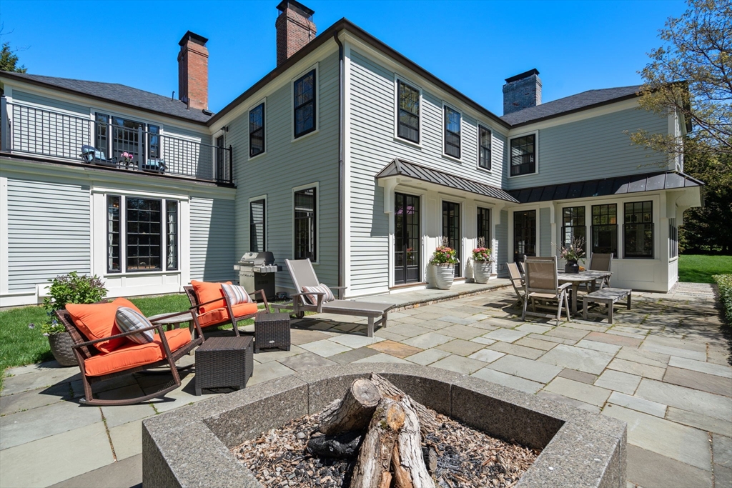 21 Sargent Crossway Brookline, MA 02445 - Photo 9 of 36 a view of a patio with couches table and chairs and potted plants