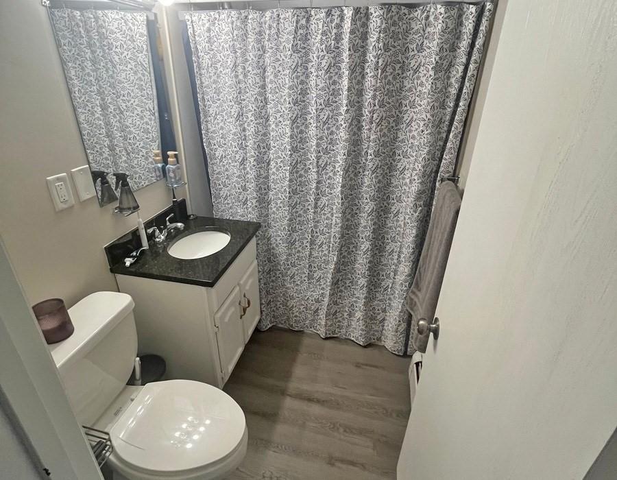 135 Main Street Upton, MA 01568 - Photo 13 of 19 a white toilet sitting next to a sink