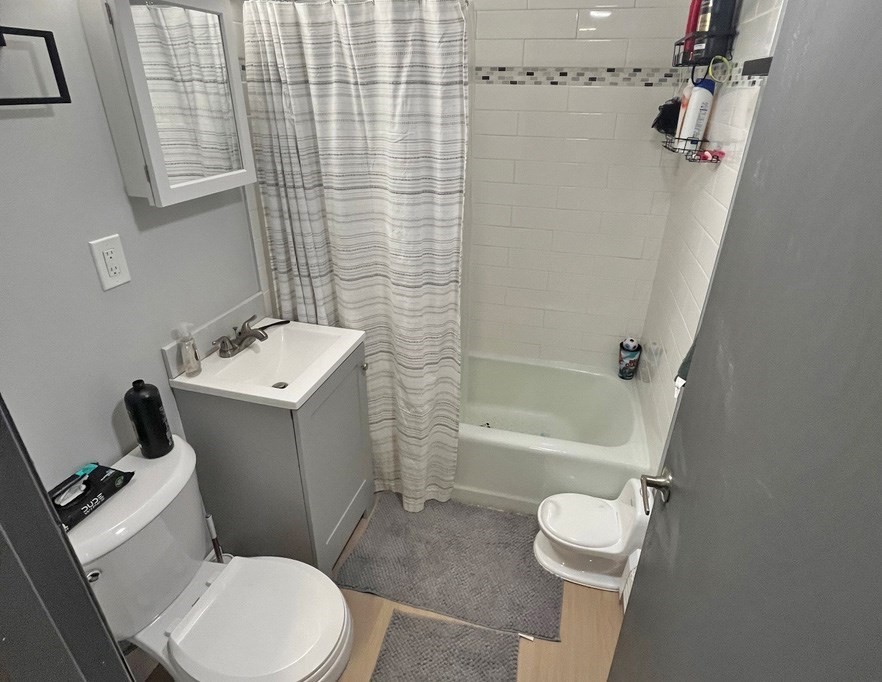 135 Main Street Upton, MA 01568 - Photo 14 of 19 a white toilet sitting next to a bath tub