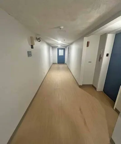 a sign that is sitting on a wooden floor