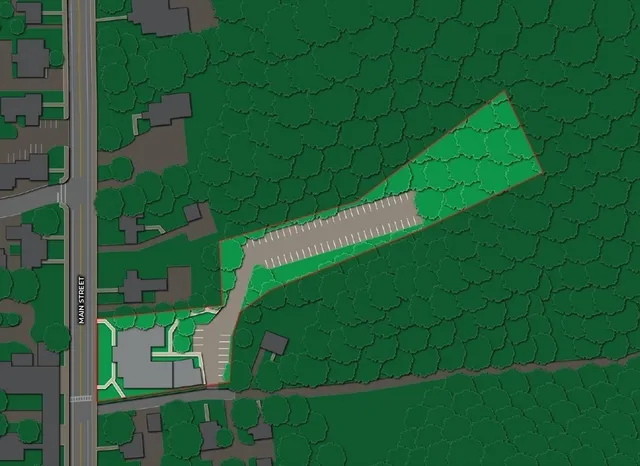 an aerial view of residential houses with outdoor space and street view