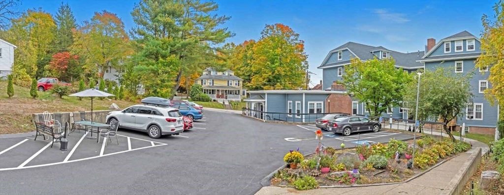 135 Main Street Upton, MA 01568 - Photo 4 of 19 a car parked in front of a building