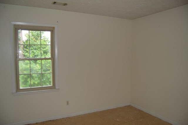 1608 Macon Road Perry, GA 31069 - Photo 9 of 11 an empty room with a window