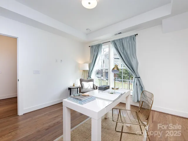 a view of a livingroom with furniture and wooden floor