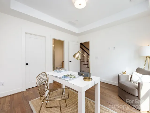 a view of a livingroom with furniture and a table