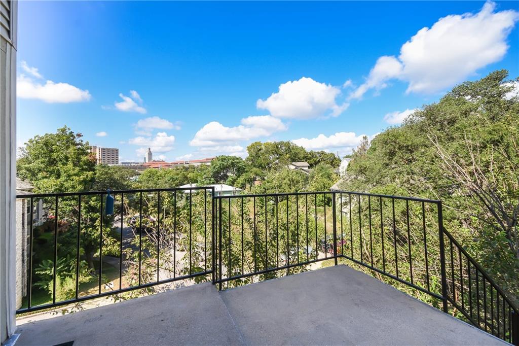 3115 Tom Green Street, Unit 404 Austin, TX 78705 - Photo 15 of 19 Outdoor balcony featuring a concrete surface and black metal railing
