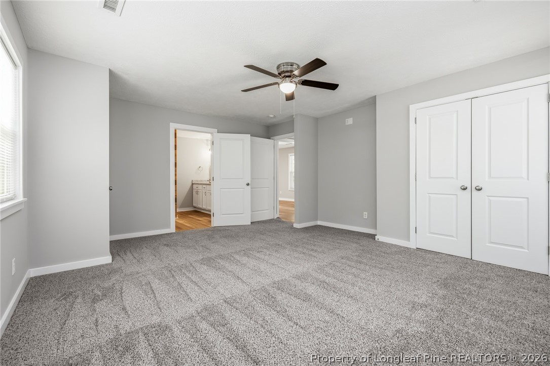 3524 Pine Log Road Lumberton, NC 28360 - Photo 30 of 42 a view of an empty room with a ceiling fan
