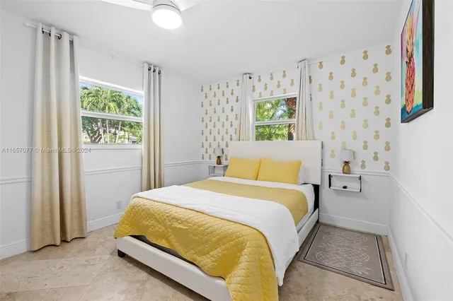 a bed room with a bed and a window