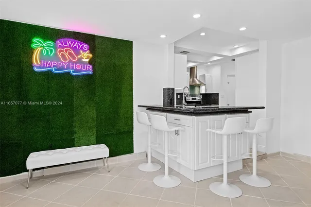 a kitchen with a sink and chandelier