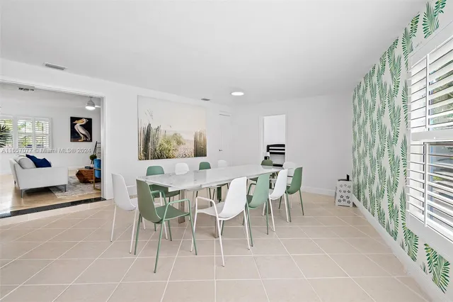 a view of a dining room with furniture and a livingroom