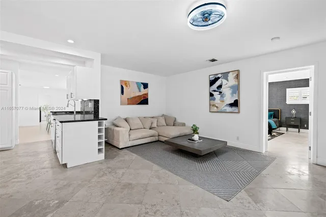 a living room with furniture and a table