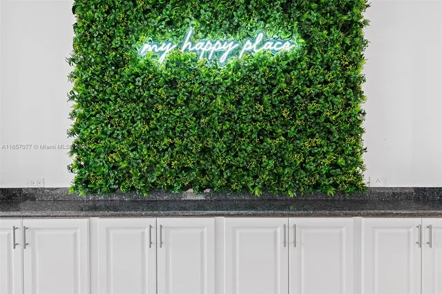 a front view of a house with a garden and yard