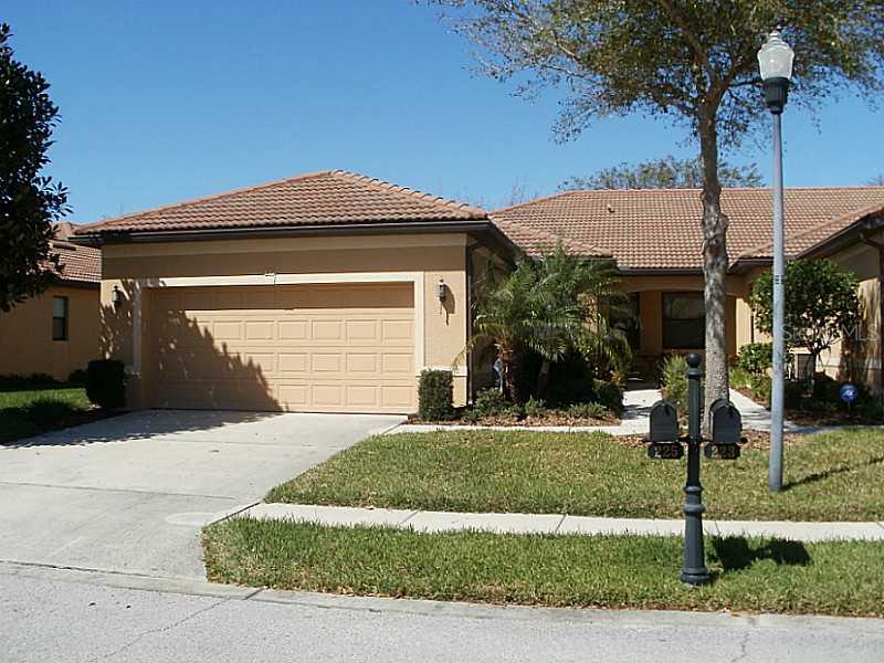 225 Shell Falls Drive Apollo Beach, FL 33572 - Photo 1 of 1 a front view of a house with garden