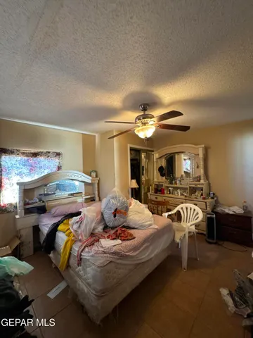 a bedroom with furniture and a chandelier