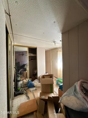 a living room with furniture and a mirror