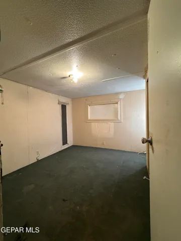 an empty room with a empty space and window