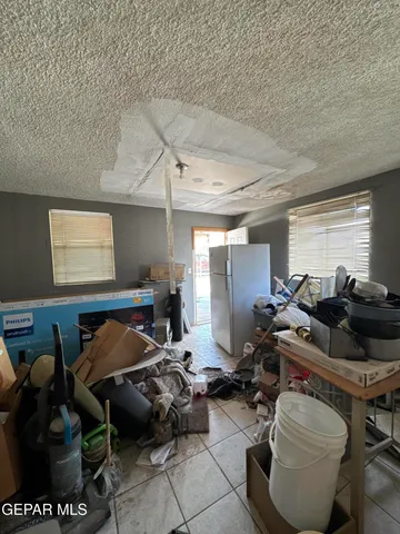 a living room with furniture a air conditioner and a window